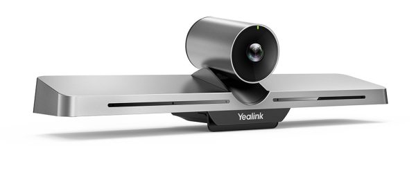 A sleek, modern video conferencing camera, the Yealink VC210, features a cylindrical lens mounted on a wide, flat base. The base includes vents and proudly displays the "Yealink" brand name. The design is distinguished by its clean, metallic finish.