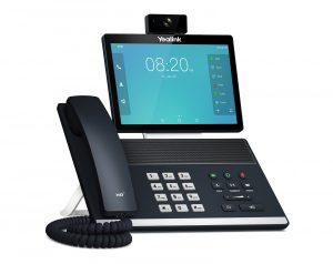 The VP59 is a high-tech office phone featuring a large touchscreen display that shows the time as 08:20 and the date as Fri, June 25. It comes equipped with a traditional handset, keypad, and various function buttons. Additionally, there's a camera mounted on top, indicating support for video calls.